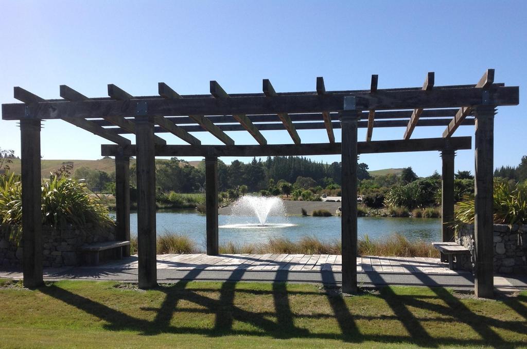 The Fairways Accommodation Kaikoura Exterior photo The lake at the centre of the park