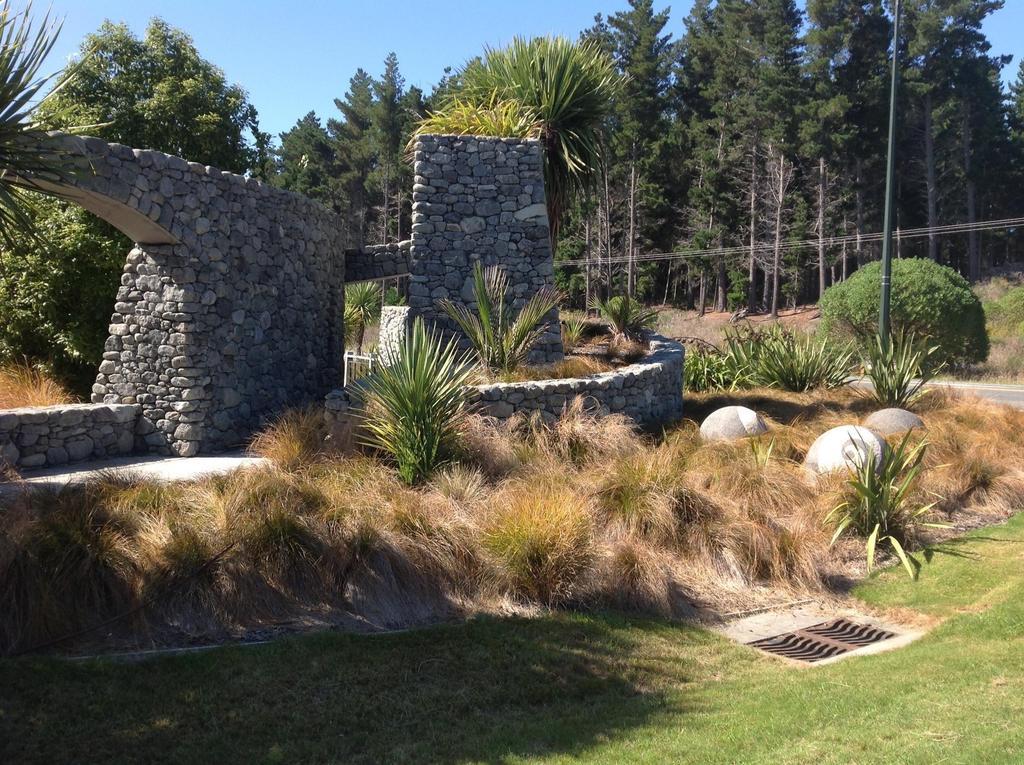 The Fairways Accommodation Kaikoura Exterior photo The stonework at the entrance to the park